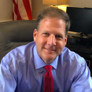 Six Fined for Protest Outside Sununu’s Home File Lawsuit